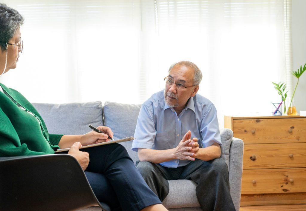 Geriatric older adult man receiving mental health help