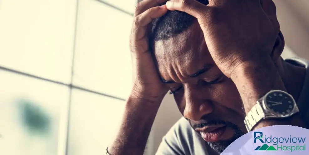 Man holding his head