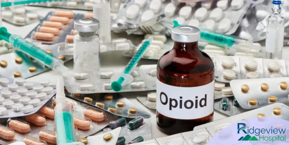 Opioid bottle near different pills