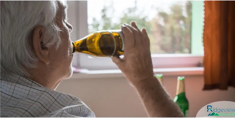man drinking alcohol