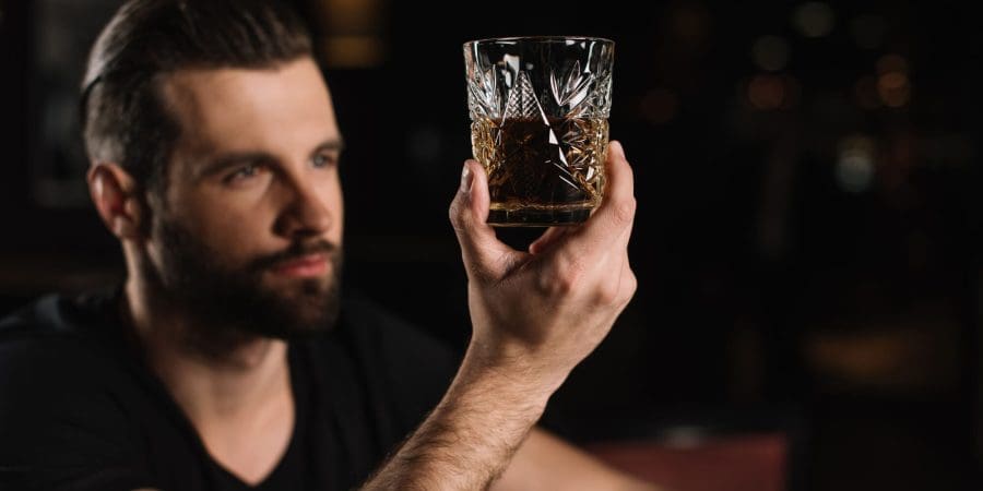 man holding an alcohol drink - illustration