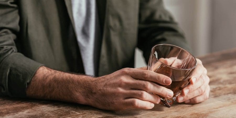 man holding drinking alcohol