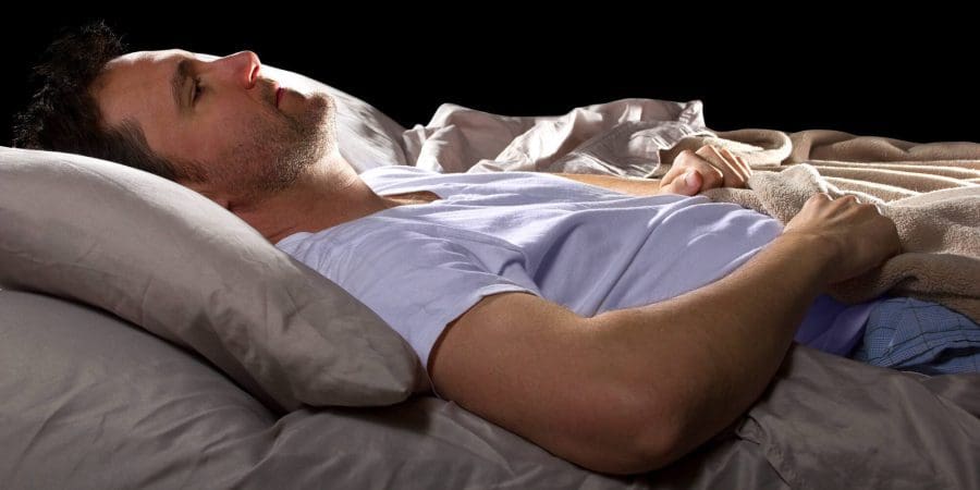 man laying down detoxing at home