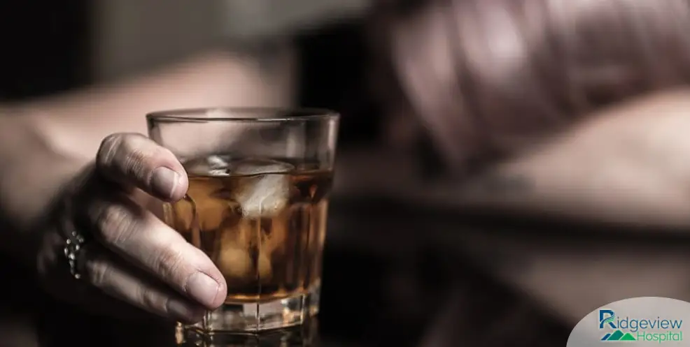 person drinking alcohol with addiction