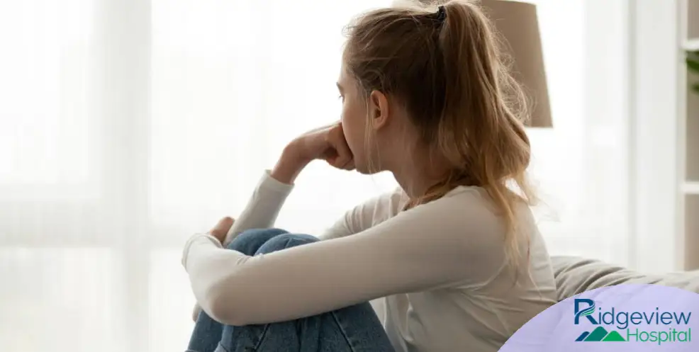 woman sitting down feeling depress